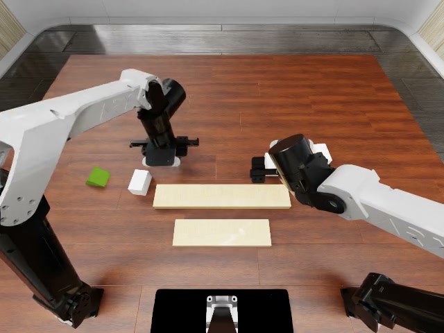 A robotic arm builds a tower
